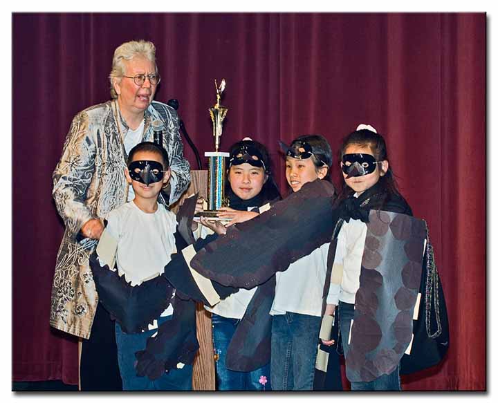 Nancy DeStefanis presenting the first place trophy to the Black Phoebes